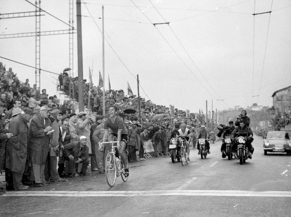 Tom Simpson winning the 1965 world championships in San Sebastian. Finishing line photo as he sits up to celebrate.