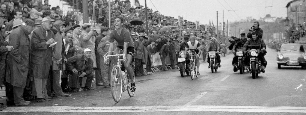 Tom Simpson winning the 1965 world championships in San Sebastian. Finishing line photo as he sits up to celebrate.