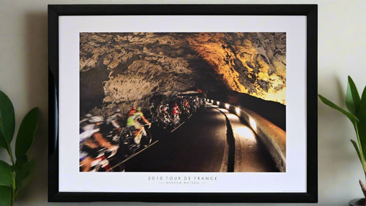 The peloton pass through the Grotto du Maz d'Azil. In pre-historic times this cave was inhabited by woolly mammoths - now by professional cyclists.