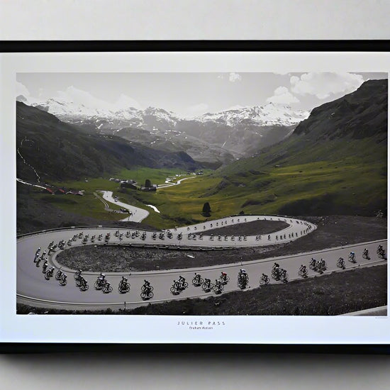 The peloton descends the Julier Pass on Stage 8 of the 2013 Tour de Suisse, speeding down the twisting alpine roads.