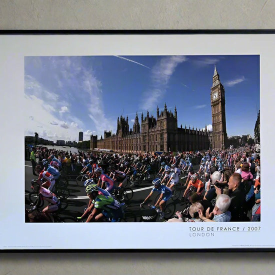 The peloton passes the Houses of Parliament and Big Ben during the 1st stage of the 2007 Tour De France.