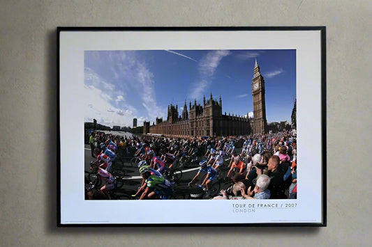 The peloton passes the Houses of Parliament and Big Ben during the 1st stage of the 2007 Tour De France.