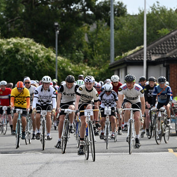 A boy in full retro Peugeot kit leading a group of riders at the 2024 Simpson Retro in Harworth.