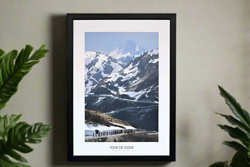 The peloton climbs the Furka Pass, winding through the rugged alpine terrain during the 2006 Tour of Switzerland.