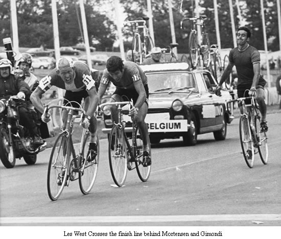 Image of Les West crossing the finish line behind Mortensen and Gimondi