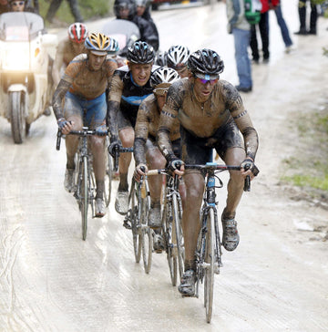 Dario Cioni leading a group through horrible conditions