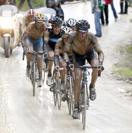 Dario Cioni leading a group through horrible conditions