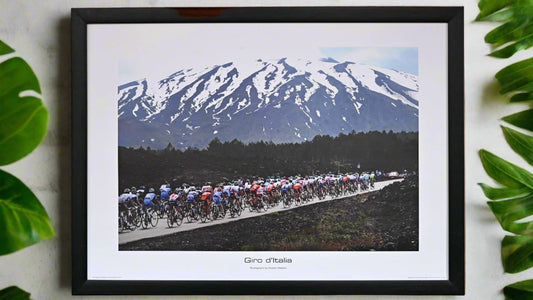 The peloton of the 2011 Giro d'Italia climb towards Mount Etna - Europe's highest active volcano.