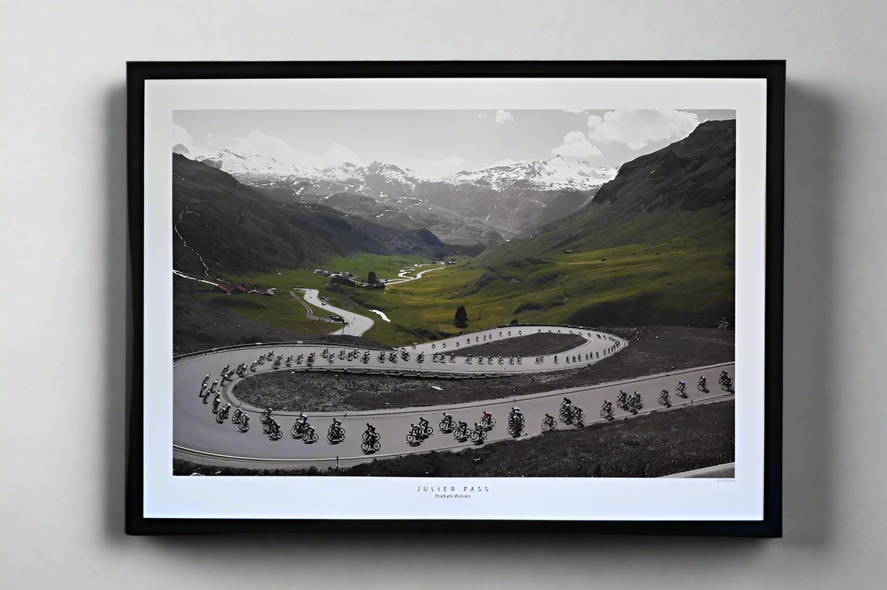 The peloton descends the Julier Pass on Stage 8 of the 2013 Tour de Suisse, speeding down the twisting alpine roads.