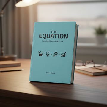 A blue-covered book titled 'THE EQUATION' by Richard Oakes.