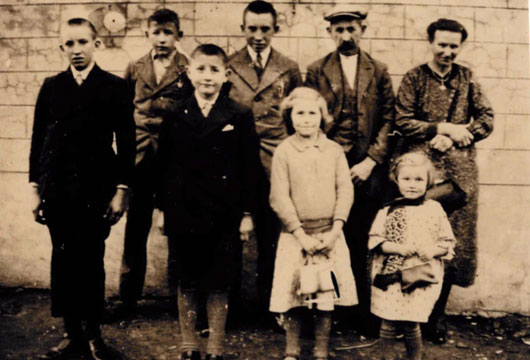 The Schotte family, Briek back row left and mum and dad back row right.