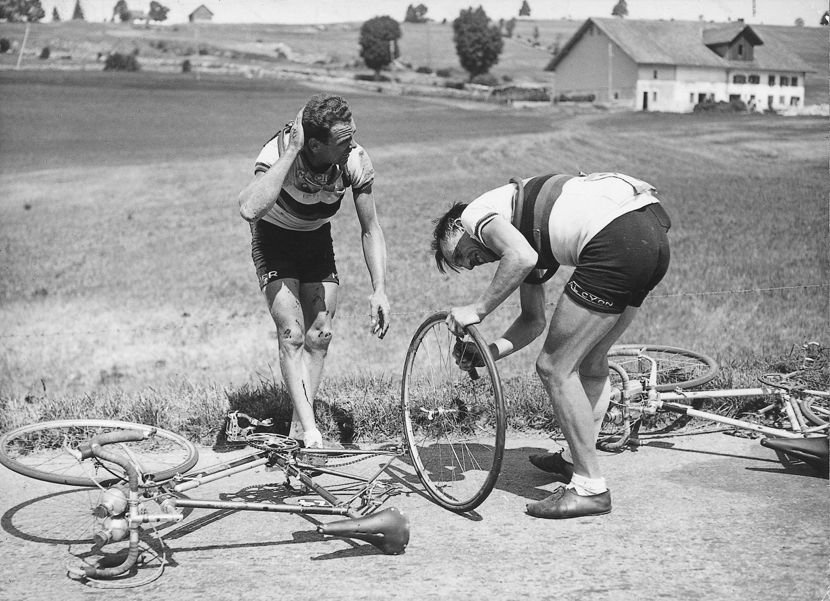 Rik Van Steenbergen (left) stops in the 1949 Tour de France with Belgian team-mate Briek Schotte